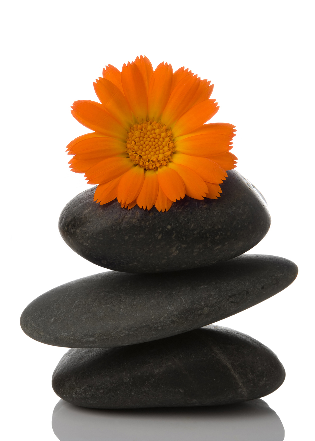 Spa stones with orange flower